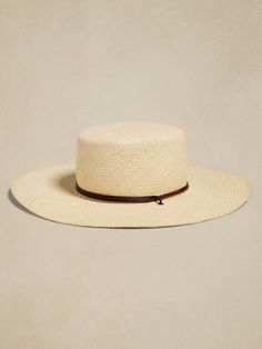 Hand-woven from Toquilla palm straw by expert artisans in Ecuador, this classically-styled Panama hat invites the wearer to make it their own, sporting only a simple black hatband.  Hampui: Rugged, yet always-refined, adventuresome Hampui hats are handcrafted from beautiful, sustainable materials that showcase the magic of the natural world.  Leather hatband and stampede strap.  Breathable cotton sweatband.  Brim Width: 4. 25" Crown Height: 4. 25" Small: 21. 7" (55cm) Medium: 22. 4" (57cm) Large White Lotus, Hat Band, Sustainable Materials, Straw Hat, Fit Inspo, Ecuador, Natural World, Panama Hat, Banana Republic