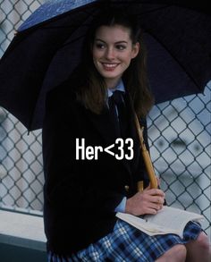 a girl in a school uniform holding an umbrella