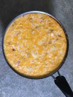 an omelet is being cooked in a skillet