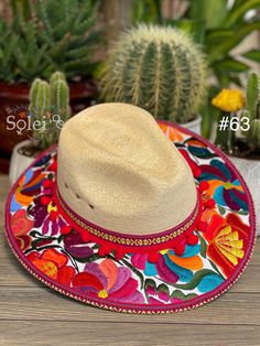 This beautiful Mexican Fedora is made out of Palm and has beautiful embroidered flowers. It is perfect to add that special touch to any outfit. The hat itself is made out of Palm and is very light and breathable. Find more colors here: https://www.etsy.com/es/listing/1002472377/sombrero-mexicano-de-palma-sombrero?ref=listing_published_alert Traditional Red Summer Hat, Traditional Wide Brim Hat For Cinco De Mayo, Traditional Curved Brim Hat For Cinco De Mayo, Traditional Hat For Cinco De Mayo Festival, Bohemian Embroidered Sun Hat For Vacation, Bohemian Embroidered Sun Hat For Spring, Traditional Curved Brim Straw Hat For Spring, Spring Bohemian Embroidered Sun Hat, Traditional Hat For Beach And Cinco De Mayo