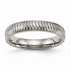 a white gold wedding ring with wavy design