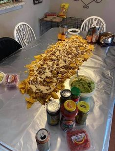 a long table covered in food and condiments