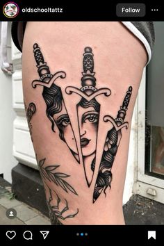 a woman's leg with tattoos on it and two knives sticking out of the side