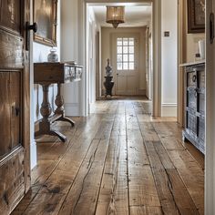 An English countryside hallway with rich, warm hardwood floorboards, showcasing the natural grain and character of the wood4 Silo Cottage, Kitchen Extension Open Plan, Cottage Foyer, English Countryside Aesthetic, Cozy Entryway, English Countryside Home, Classic Entrance, Countryside Aesthetic, Cabin Rustic