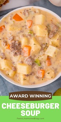 a bowl of cheeseburger soup with carrots and bread