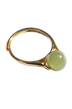 The Equinox ring features an adjustable gold-plated S925 silver gold band and a delicate nephrite bead.Natural and untreated nephrite. Made by handwork of carving and polishing. Because of the gemstone’s natural characteristics, each piece may vary slightly in colors and textures. Weight: 2g Band: Gold-plated S925 sterling silver, 1.5mm width, 1mm thick Bead: Nephrite diameter 7mm Adjustable Jade Ring, Adjustable Elegant Jade Rings, White Rings, Jade Ring, Green Bead, White Ring, Gold Band, Gold Plated Sterling Silver, Womens Jewelry Rings