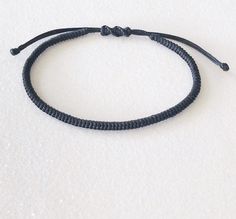 Simple Braided Bracelet Waxed Cord, Gift for Friends MATERIAL 🔹 Waxed Nylon Cord 🔹 Easy to put on and adjust with the adjustable sliding closure. Standard women size 6 - 7.5 inches Standard men size 6.5 - 8 inches All items are handmade with love just for you! 🔹 Check out our shop for more anklets https://www.etsy.com/shop/JustSeedBeads?ref=seller-platform-mcnav§ion_id=23857241 Thank you! Simple Adjustable Black Bracelets, Minimalist Braided Bracelets With Adjustable Waxed Cord, Minimalist Braided Bracelets With Adjustable Cord, Minimalist Adjustable Bracelet With Black Band, Everyday Bracelets With Sliding Knot And Nylon Cord, Minimalist Adjustable Waxed Cord Bracelets, Minimalist Nylon Cord Friendship Bracelet With Sliding Knot, Handmade Minimalist Bracelets With Nylon Cord, Adjustable Minimalist Friendship Bracelets With Waxed Cord