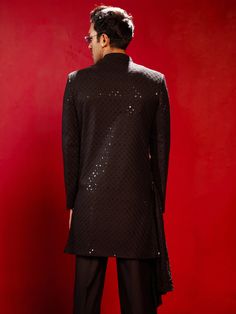 VASTRAMAY Men's Black Sequined Indo Western Top Make a bold statement with this eye-catching black sherwani top, featuring all-over sequined embellishments for a touch of glamour. Crafted from comfortable rayon fabric, it boasts a mandarin collar, invisible button placket, and long sleeves for a refined look. Key Features All-over black sequin embellishment Mandarin collar Invisible button placket Long sleeves Above-the-knee length Specifications Top Material: Rayon Care Instructions: Dry Clean Party Wear Long Sleeve Kurta For Diwali, Party Wear Long Sleeve Kurta For Festive Occasions, Long Sleeve Bandhgala For Parties And Festivals, Festive Long Sleeve Party Wear Kurta, Festive Long Sleeve Party Kurta, Long Sleeve Bandhgala For Diwali Party, Party Wear Long Sleeve Sherwani For Eid, Party Wear Sherwani With Long Sleeves For Eid, Party Wear Bandhgala With Long Sleeves For Diwali