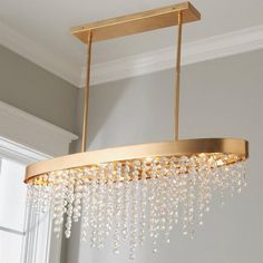 a chandelier hanging from the ceiling in a room