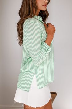 Casual yet put together is what you will get when you wear our Silas Green Striped Button Down Top! Featuring a striped green and white fabric, a collared neckline, buttons down the front placket, two front bust pockets, buttons on the sleeve cuffs, small side slits, and a rounded hem. Style this top with our Johanna Jeans to complete the look! Spring Striped Shirt With Buttons, Chic Green Shirt For Daywear, Spring Striped Shirt With Button Closure, Daywear Striped Blouse With Striped Collar, Striped Shirt With Button Closure For Spring, Green Summer Blouse With Placket, Striped Collared Blouse For Spring, Casual Green Shirt With Vertical Stripes, Green Blouse With Placket For Summer