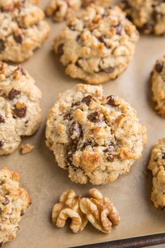 cookies and walnuts on a baking sheet ready to be baked in the oven for consumption