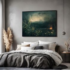 a painting hanging on the wall above a bed in a room with a large window