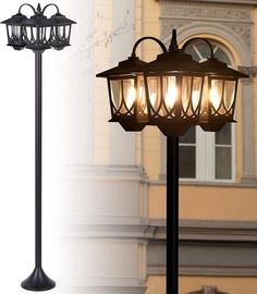 an old fashioned lamp post with four lights on it's sides and a building in the background