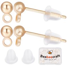 three pairs of gold and white pearled ear plugs with an ad for beebeecraft