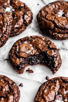 chocolate cookies are cut in half and placed on top of each other with one bite taken out