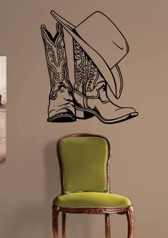 a cowboy hat and boots wall decal on a chair in a room with a green chair