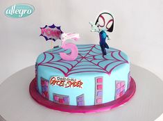 a spiderman themed birthday cake on a table