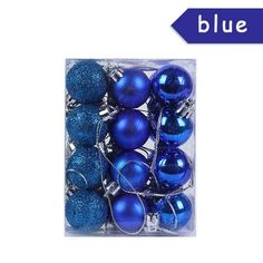 blue christmas ornaments in a clear box with the word blue on it's side