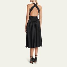 ALAÏA dress features an open back with crossover straps Scoop neckline Sleeveless Ruched drawstring back waist Full, pleated skirt Hem falls below the knee Fit & flare silhouette Slipover style Acetate/viscose Made in Italy Backless Midi Dress With Ruched Back For Cocktail, Backless Cocktail Midi Dress With Ruched Back, Backless Midi Dress With Ruched Bodice For Cocktail, Backless Cocktail Midi Dress With Ruched Bodice, Backless Ruched Midi Dress For Evening, Ruched Backless Midi Dress For Evening, Evening Ruched Midi Backless Dress, Evening Ruched Backless Midi Dress, Evening Midi-length Ruched Backless Dress