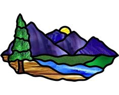 a stained glass window with trees and mountains in the background