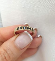 Handmade delicate Black Onyx, half eternity stacking ring, stoned with 7 beautiful shiny Onyx, diamond shaped faceted gemstones.  This multistone eternity ring is beautiful alone or stacked together with other rings and is delicate and pretty on your finger.  The ring is available in nickel free, 14k gold plating over brass or silver base as well as, solid silver or 9k and 14k solid gold- yellow, white or rose gold. A perfect engagement ring or just a beautiful gift for you. Gemstones alternative include garnet, sapphire, tourmaline ruby citrine and peridot. Dimensions: The ring width is about 2 mm. Multiple ring sizes are available. If you need an additional different size just convo me. For other rings I make: https://www.etsy.com/il-en/shop/EfratMakovJewelry?ref=listing-shop2-all-items- Anniversary Ring With Black Diamonds, Round Band, Anniversary Ring With Black Diamonds In Round Band, Fine Jewelry Black Stackable Rings, Black Gemstone Stackable Rings For Anniversary, Black Stackable Rings Fine Jewelry, Black Stackable Fine Jewelry Rings, Black Stackable Round Cut Rings, Black Fine Jewelry Rings For Everyday, Everyday Black Fine Jewelry Ring