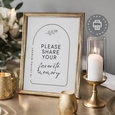 there is a framed sign on the table next to some candles and other decor items