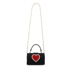 New this season, and one for the romantics, fall in love with the Amora Shoulder bag. Featuring a black leather outer with top handle, the newest design is adorned with a red crystal heart and outlined with clear crystal gems. Perfectly complement your date night fit or pick yours for the perfect gift for a loved one. Measurements: Width 18cm, Height 11.5cm, Depth 7cm Exterior: Textile, Leather, Interior: Textile, Leather HANDMADE IN: Spain Valentine's Day Evening Crossbody Shoulder Bag, Valentine's Day Evening Crossbody Bag, Chic Black Heart-shaped Shoulder Bag, Chic Black Heart-shaped Bag, Valentine's Day Evening Shoulder Bag, Chic Black Bag For Valentine's Day, Black Embellished Top Handle Bag, Luxury Shoulder Bag For Valentine's Day Evening, Luxury Evening Shoulder Bag For Valentine's Day