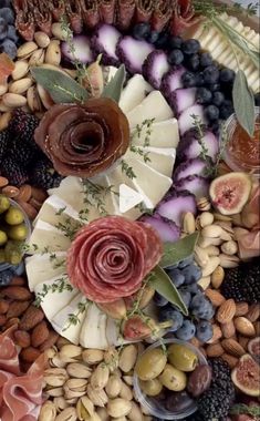 a platter filled with different types of fruits and veggies on top of each other