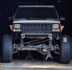 an off road vehicle is parked in a garage