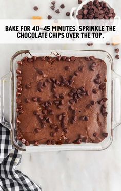 a baking dish with chocolate chips and sprinkles in it, on top of a checkered napkin