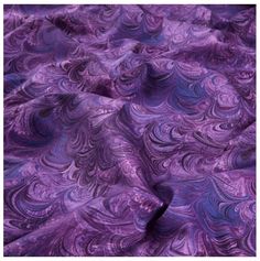 a purple and blue fabric with swirls on the top, as well as an image of