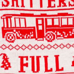 a red and white knitted sweater with trains on it