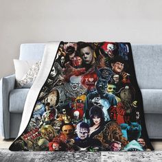 a couch with a blanket on it covered in many different movie characters and their names