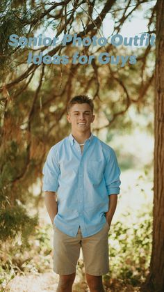 a man standing in front of a tree with his hands in his pockets and smiling at the camera