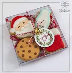 a box filled with cookies and decorated cookies