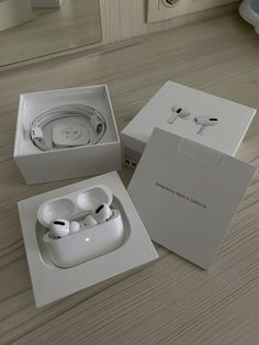 two new apple airpods are in the box and ready to be shipped into the store