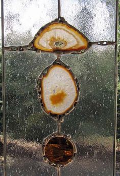 an old stained glass window with three circles