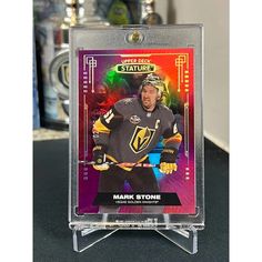 the hockey card is on display in a clear acrylic case with an image of mark strome