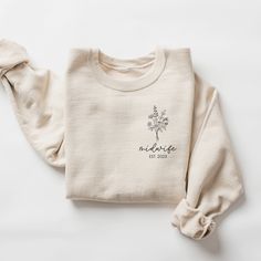 ** Please note: Orders placed after December 8 may not arrive by Christmas.  We will still do our best to fulfill all orders as quickly as possible.  We appreciate your understanding.  Happy Holidays  Introducing our cozy and stylish custom midwife shirt! This beautiful sweatshirt features a unique pocket design that includes a beautiful bouquet of flowers alongside the words "midwife" and "est" with a custom year. It's the perfect way to show off your passion for supporting mothers and families Midwife Shirt, Embroidery Crewneck, Poodle Mom, Papa Shirts, December 8, Mama Shirts, Dog Sweatshirt, Charles Spaniel, Jack Russell Terrier