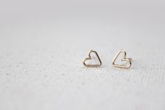 Tiny Open Heart Earring Studs - Hand Formed - Gold - Lorelai. $20.00, via Etsy. Dainty 14k Gold Filled Heart Earrings For Everyday, Dainty Tiny Gold Heart Earrings, Cute Small Everyday Jewelry, Minimalist Gold Hypoallergenic Heart Earrings, Minimalist Open Heart Earrings For Everyday, Gold Minimalist Heart Earrings For Everyday, Tiny Minimalist Heart Earrings, Delicate Gold Heart Earrings For Everyday, Dainty Yellow Gold Heart Earrings For Everyday Wear