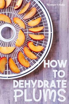 the cover of how to dehydraate plums is shown on a wooden table