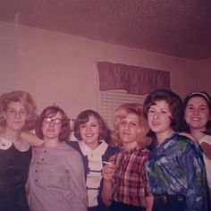 a group of women standing next to each other