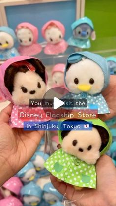 someone is holding two small dolls in their hands with the caption you must visit the disney flagshop store in shinjuu tokyo