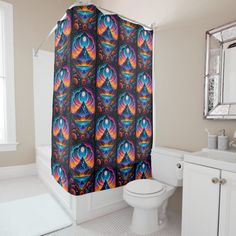 a colorful shower curtain in a bathroom