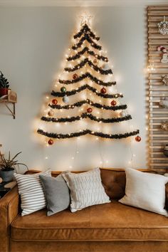 15 Cozy Christmas Ideas for Your Tiny Living Room Diy Living Room Christmas Decor, Christmas Decor Corner Ideas, Christmas Small Decorations, Small Christmas Apartment, Small Christmas Tree Living Room, Small Studio Christmas Decor, Christmas Decor Ideas No Tree, Wall Christmas Decor Ideas, No Room For Christmas Tree