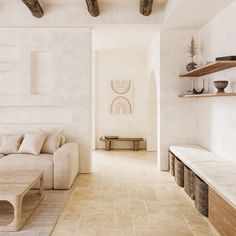 a living room filled with furniture and white walls