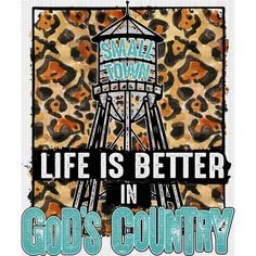 the words life is better in god's country on an image of a water tower