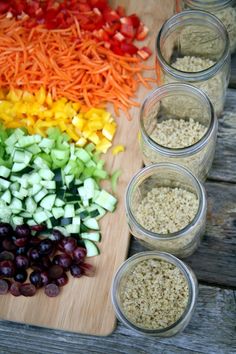 an assortment of vegetables are arranged on a cutting board and ready to be put into bowls