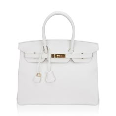 Hermes Birkin 35 bag featured in White.Lush with Gold hardware.A beautiful year round neutral color., white is the most rare of all Hermes colours produced in leather.This Hermes Birkin is created with plush Clemence leather.Comes with lock, keys, clochette, and sleepers.Very like new body, corners, handles and interior.Hardware has very minor markings.Mightychic has excelled in customer service for 21 years and provides a discreet online shopping experience for beautiful Hermes selections. final saleBAG MEASURES:LENGTH 3 5cm / 14"TALL 25 cm / 10"DEEP 18 cm / 7"HANDLES:TALL 5CONDITION:LIKE NEW Will be delivered with Box, dust bag, card, booklet and receipt Exchange Accepted in this cases :/p>