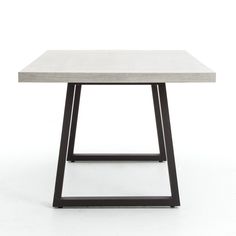 a white table with black metal legs and a square top, on a white background